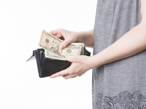 Woman with money in purse in hands