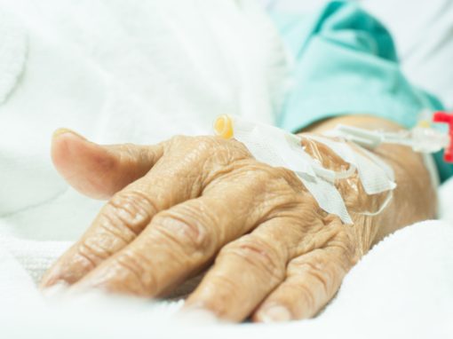 Hand of an old woman patient in hospital with saline