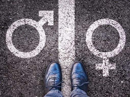 Legs with gender symbol on asphalt, gender concept